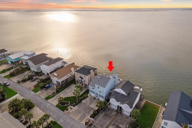 aerial view with a water view and a residential view