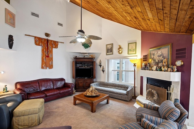 living room with lofted ceiling, a ceiling fan, visible vents, wood ceiling, and carpet floors