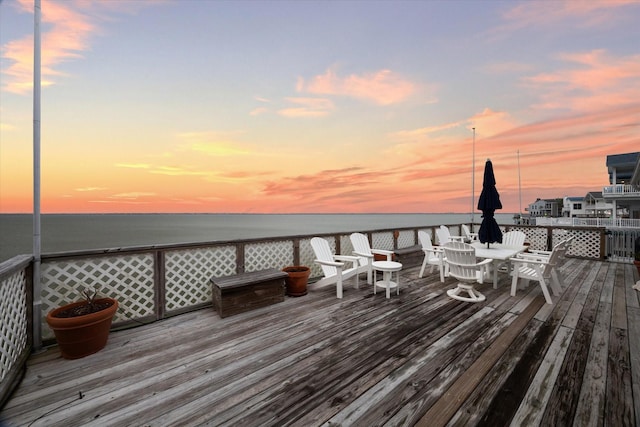 wooden terrace featuring a water view