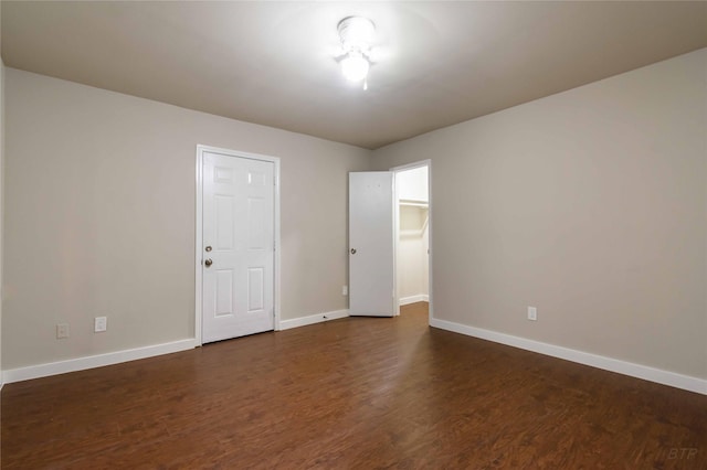 12046 Beechnut St, Houston, TX 77072 - spare room featuring dark wood-style flooring and baseboards