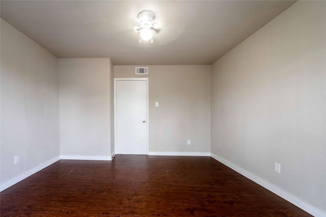 12046 Beechnut St, Houston, TX 77072 - spare room with visible vents, baseboards, and dark wood-style floors