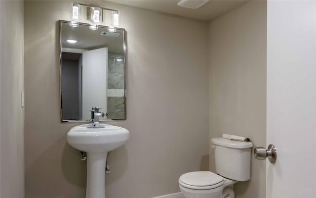 12046 Beechnut St, Houston, TX 77072 - bathroom featuring toilet and baseboards