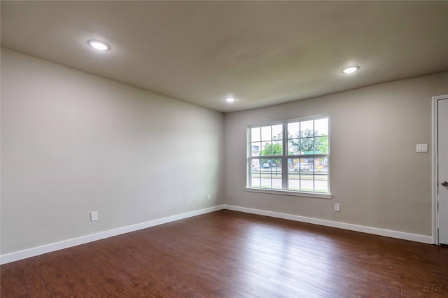 12046 Beechnut St, Houston, TX 77072 - spare room featuring baseboards, dark wood-style floors, and recessed lighting