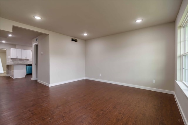 12046 Beechnut St, Houston, TX 77072 - unfurnished room featuring recessed lighting, dark wood-style floors, and baseboards
