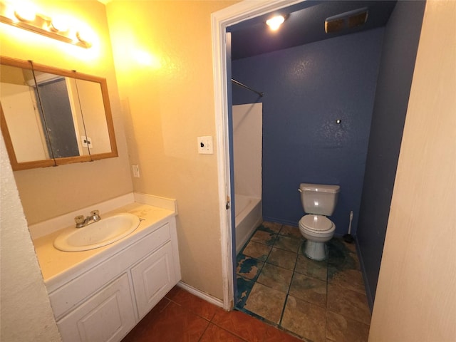 bathroom with washtub / shower combination, tile patterned floors, vanity, and toilet