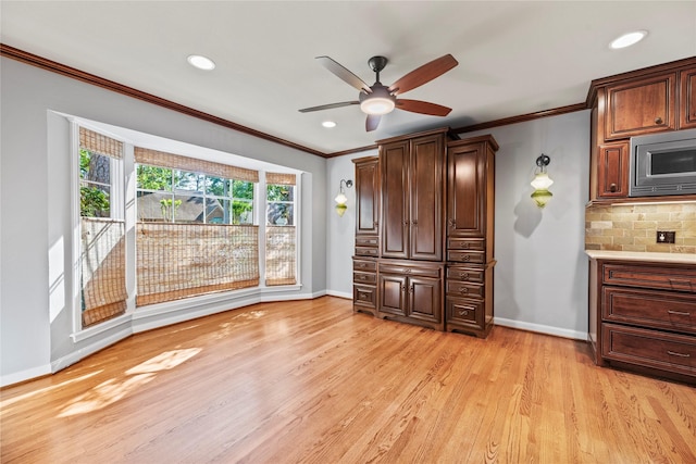 interior space with crown molding, recessed lighting, baseboards, and light wood-style floors