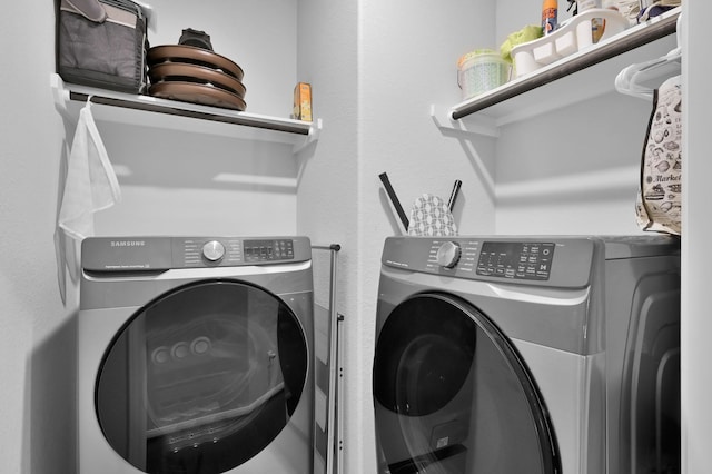 washroom featuring independent washer and dryer and laundry area