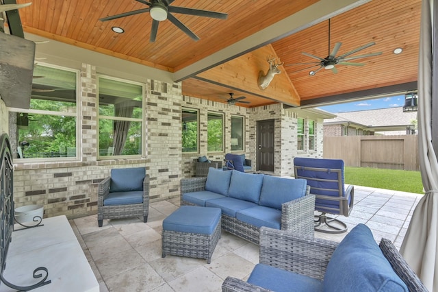 view of patio / terrace with outdoor lounge area, ceiling fan, and fence