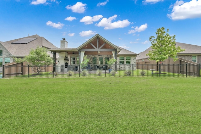 back of house with fence, a yard, and a patio