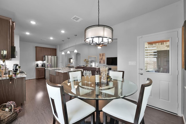 dining room with visible vents, recessed lighting, and dark wood-style floors