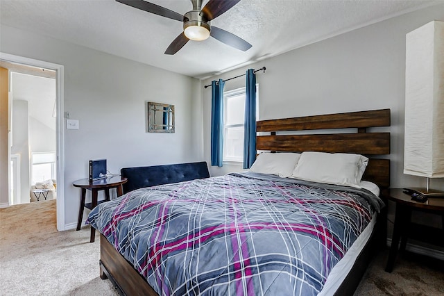 bedroom featuring baseboards, a ceiling fan, and carpet