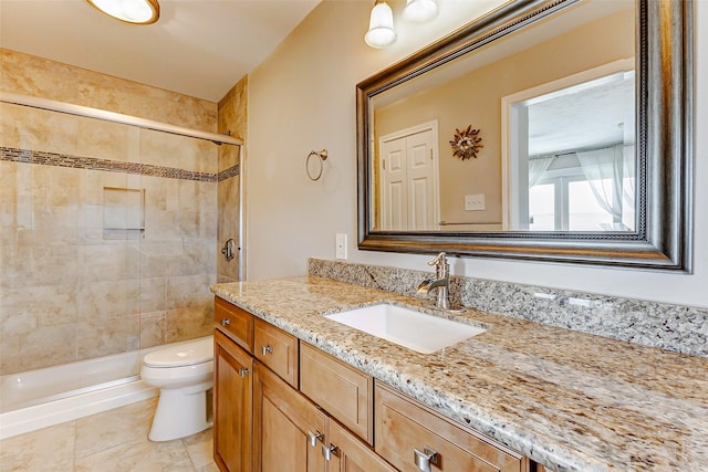 bathroom featuring a shower stall, vanity, and toilet
