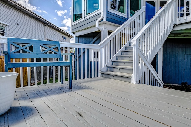 wooden deck featuring stairway
