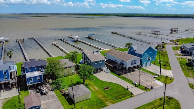 aerial view with a residential view and a water view