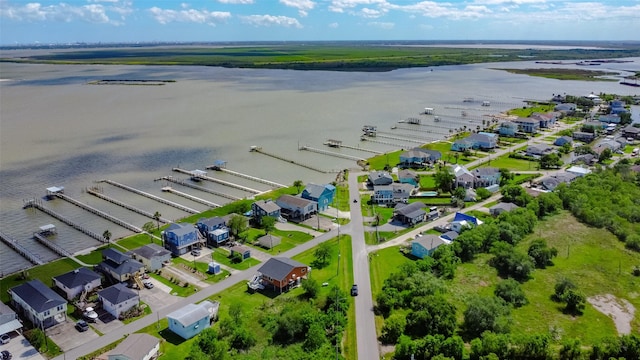 bird's eye view with a residential view and a water view