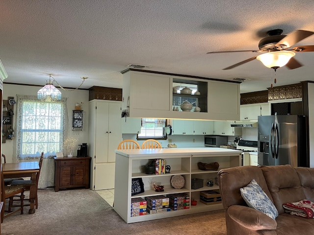 kitchen with light carpet, white gas stove, black fridge with ice dispenser, and a textured ceiling