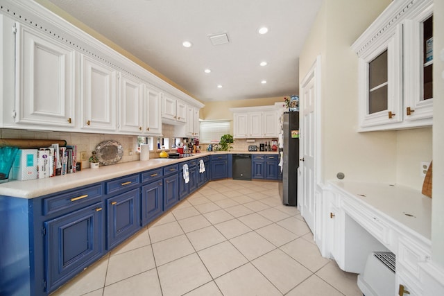 kitchen with freestanding refrigerator, white cabinetry, black dishwasher, blue cabinets, and light tile patterned flooring
