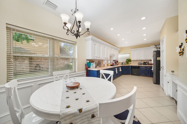 dining area featuring visible vents, light tile patterned floors, a notable chandelier, recessed lighting, and a wainscoted wall