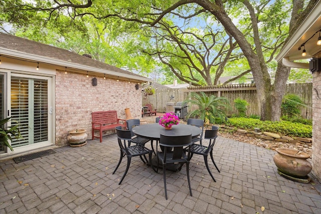 view of patio / terrace with a fenced backyard and outdoor dining space