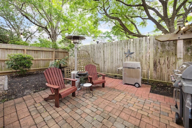 view of patio / terrace featuring a fenced backyard and area for grilling