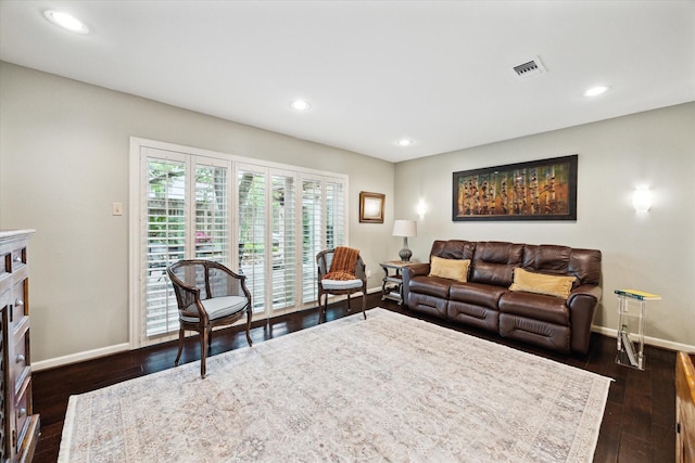 living room with visible vents, baseboards, recessed lighting, and dark wood-style floors