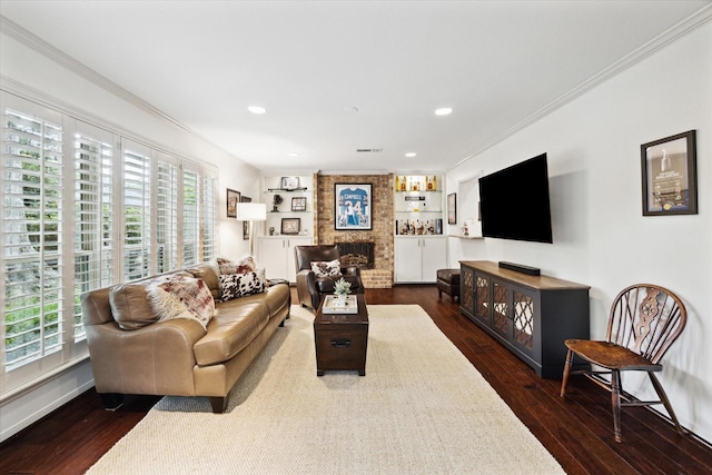 living area featuring a wealth of natural light, ornamental molding, and dark wood finished floors