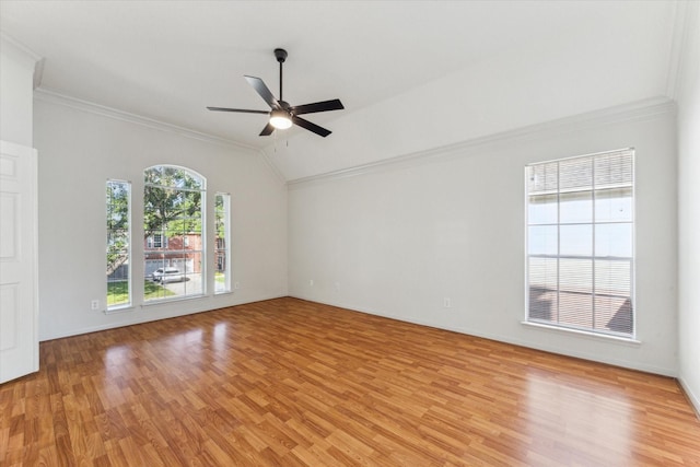 empty room featuring crown molding, a ceiling fan, and light wood-style floors