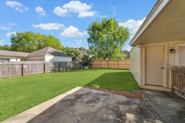 view of yard featuring a patio and a fenced backyard
