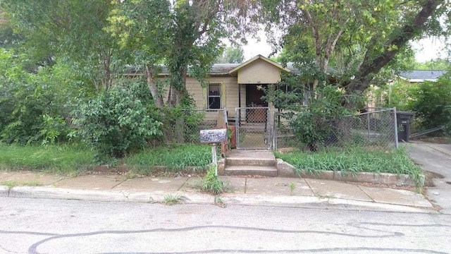 view of front of home featuring a gate and a fenced front yard