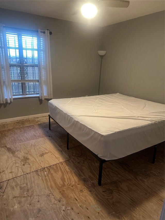 bedroom featuring baseboards