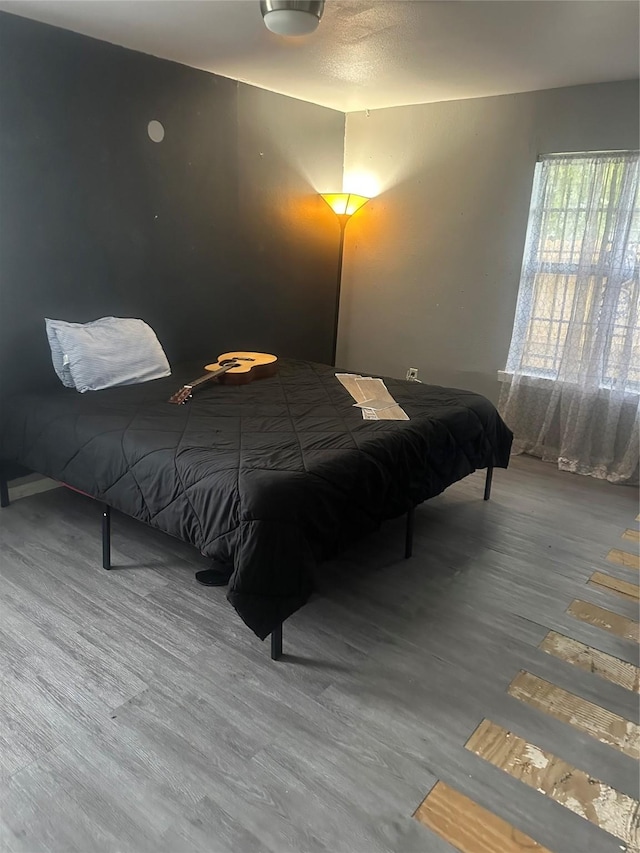bedroom featuring wood finished floors