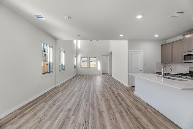 21624 Alberta Forest Cir, Magnolia, TX 77355 - kitchen with tasteful backsplash, visible vents, recessed lighting, appliances with stainless steel finishes, and a sink