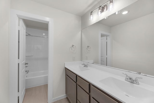 21624 Alberta Forest Cir, Magnolia, TX 77355 - full bathroom with tub / shower combination, double vanity, a sink, and baseboards