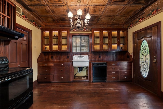 kitchen with an ornate ceiling, an inviting chandelier, glass insert cabinets, and black appliances