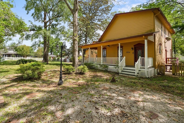 view of front of property with a porch and a ceiling fan