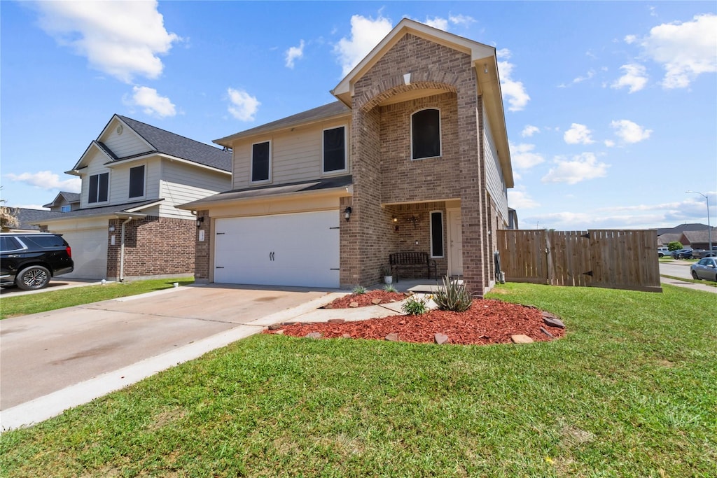 10810 Brittan Leaf Ln, Houston, TX 77034 - traditional-style home featuring a front yard, fence, brick siding, an attached garage, and driveway