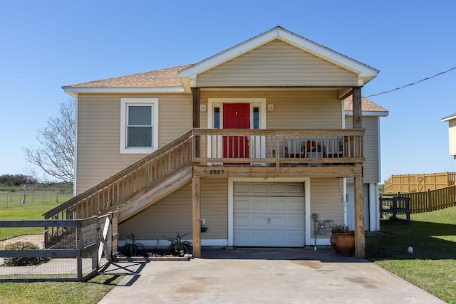 2027 103rd St, Galveston, TX 77554 - view of front of property featuring stairs, a porch, a garage, fence, and a shingled roof