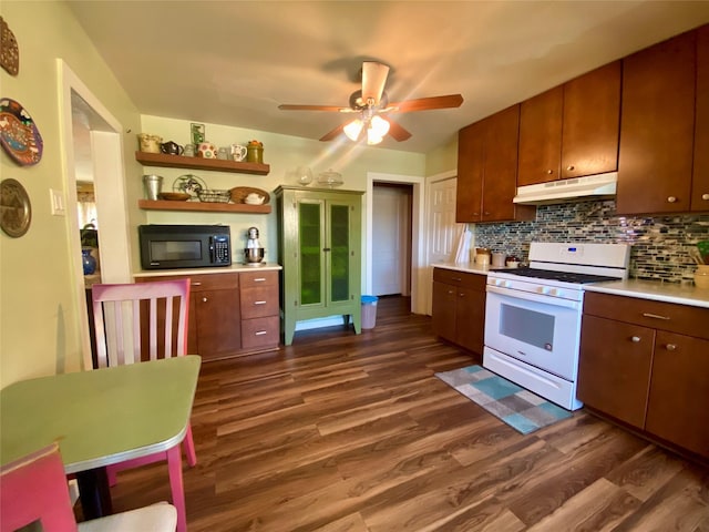 2027 103rd St, Galveston, TX 77554 - kitchen featuring light countertops, dark wood-style floors, under cabinet range hood, black microwave, and white range with gas stovetop