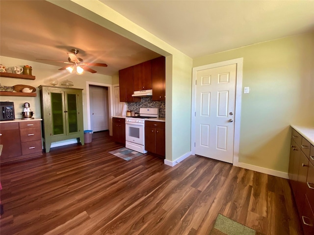 2027 103rd St, Galveston, TX 77554 - kitchen featuring baseboards, light countertops, gas range gas stove, under cabinet range hood, and dark wood finished floors