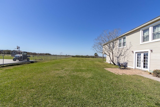 2027 103rd St, Galveston, TX 77554 - view of yard featuring french doors, fence, and a patio