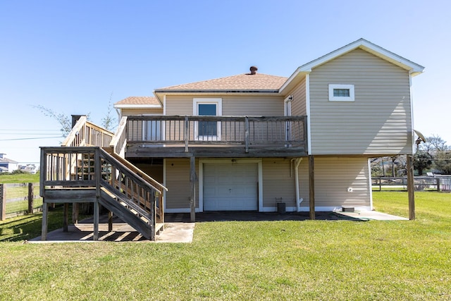 2027 103rd St, Galveston, TX 77554 - rear view of property with a shingled roof, stairway, a garage, a deck, and a lawn