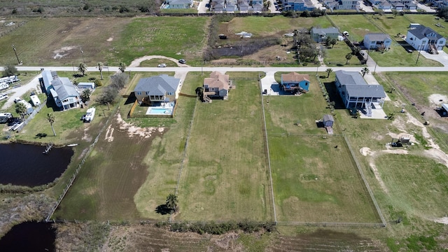 2027 103rd St, Galveston, TX 77554 - birds eye view of property featuring a water view and a residential view