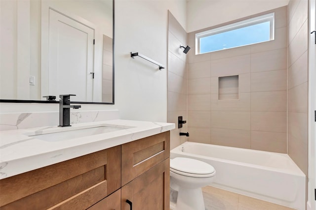 bathroom featuring bathing tub / shower combination, vanity, and toilet