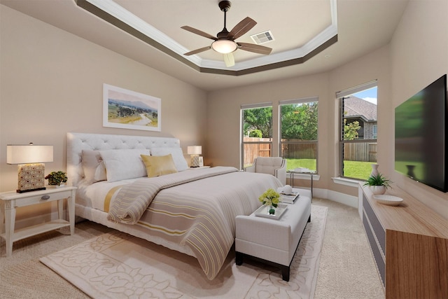 1715 Laremont Bend Dr, Spring, TX 77386 - bedroom with crown molding, light colored carpet, a tray ceiling, baseboards, and a ceiling fan