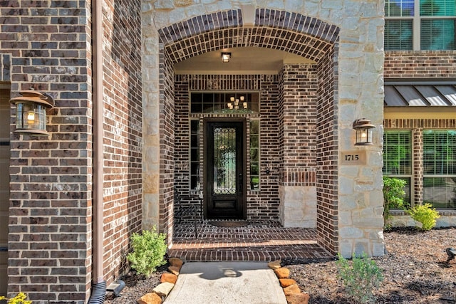 1715 Laremont Bend Dr, Spring, TX 77386 - doorway to property with brick siding, a standing seam roof, and metal roof