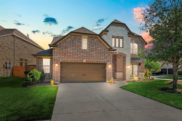 1715 Laremont Bend Dr, Spring, TX 77386 - french country inspired facade with brick siding, driveway, an attached garage, and roof with shingles