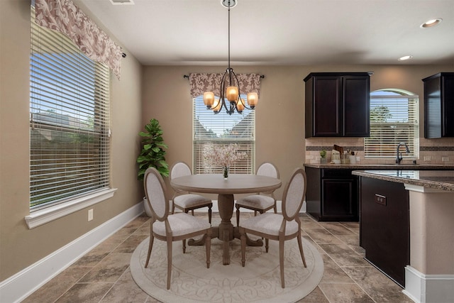 1715 Laremont Bend Dr, Spring, TX 77386 - dining space with a chandelier, baseboards, and recessed lighting