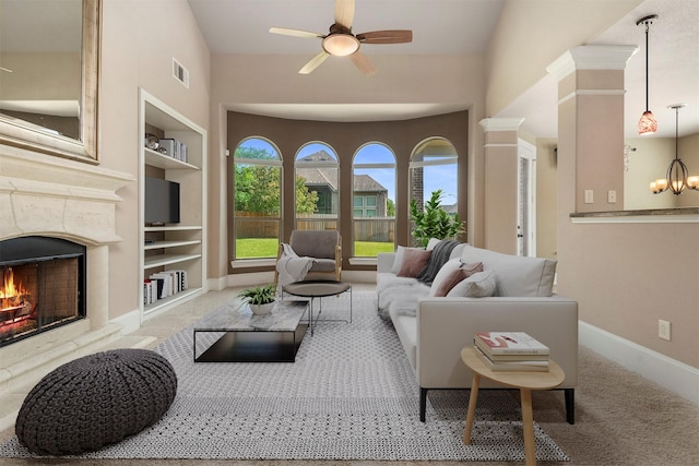 1715 Laremont Bend Dr, Spring, TX 77386 - carpeted living room featuring built in features, a high end fireplace, ceiling fan, and baseboards