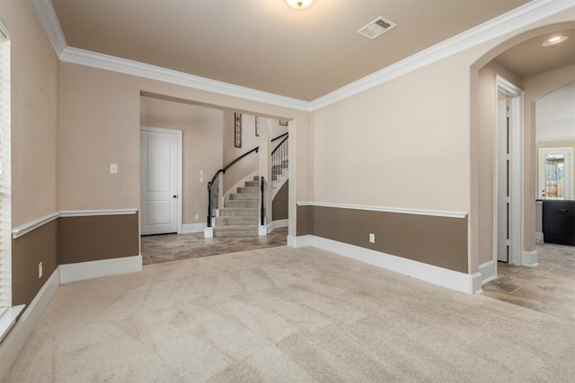 1715 Laremont Bend Dr, Spring, TX 77386 - unfurnished room with arched walkways, ornamental molding, carpet floors, stairway, and baseboards