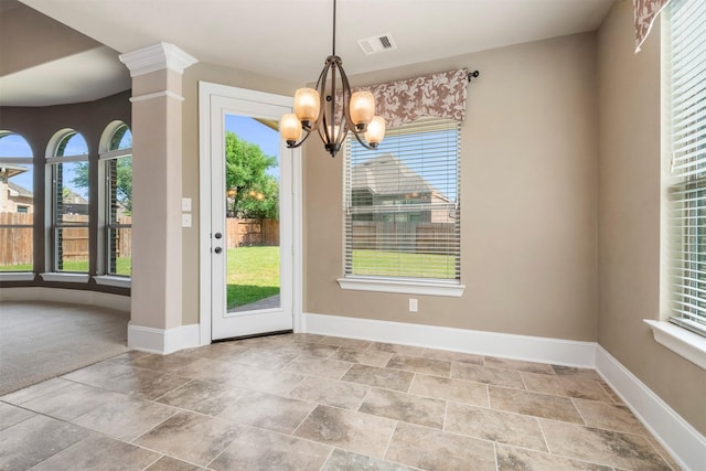 1715 Laremont Bend Dr, Spring, TX 77386 - unfurnished dining area featuring plenty of natural light, baseboards, a chandelier, and stone finish flooring